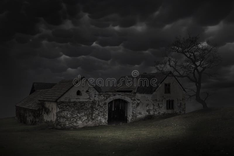 Spooky scene of haunted house and dark sky. Old house at night