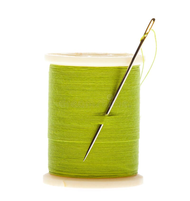 Isolated wooden spool of green thread with a needle 8414070 Stock