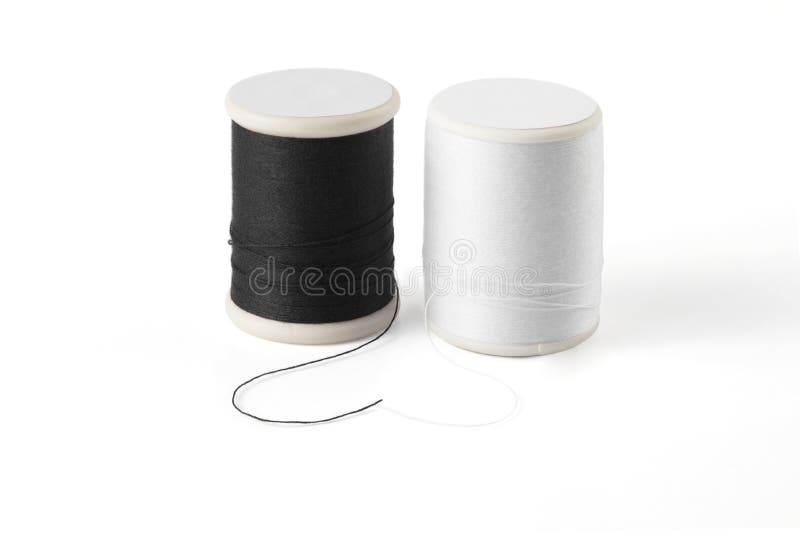 Thread spool on a white background. Basic color of thread: White, Black. royalty free stock images