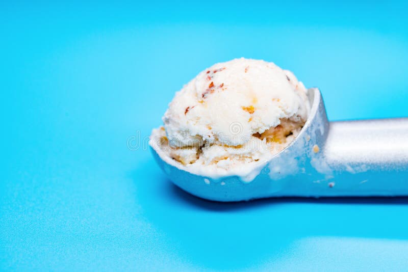 Spoon with Chestnut & Red Bean Ice Cream Ball on Blue Background Stock