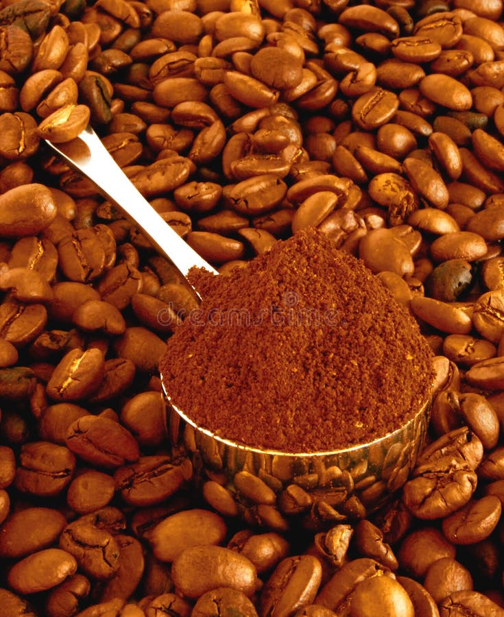 Spoon of coffee on a background grains.