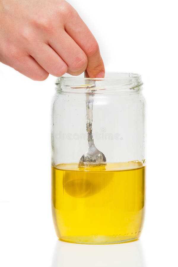 Spoon in a honey jar stock image. Image of golden, life 18893739