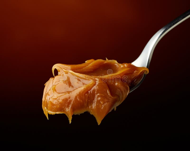 Spoon of melted caramel cream royalty free stock photos Spoon of melted caramel cream royalty free stock photos