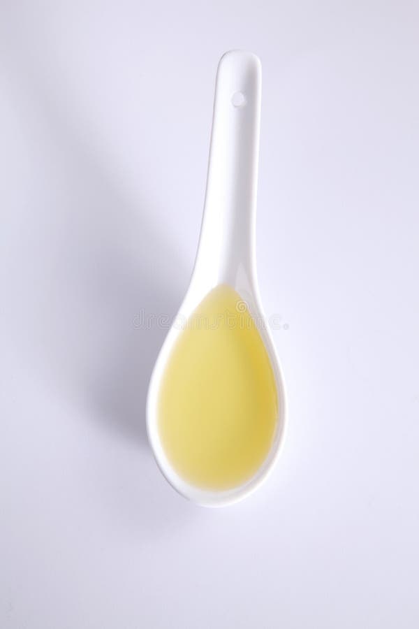 Spoon of oil stock image. Image of tablespoon, cooking 84550049