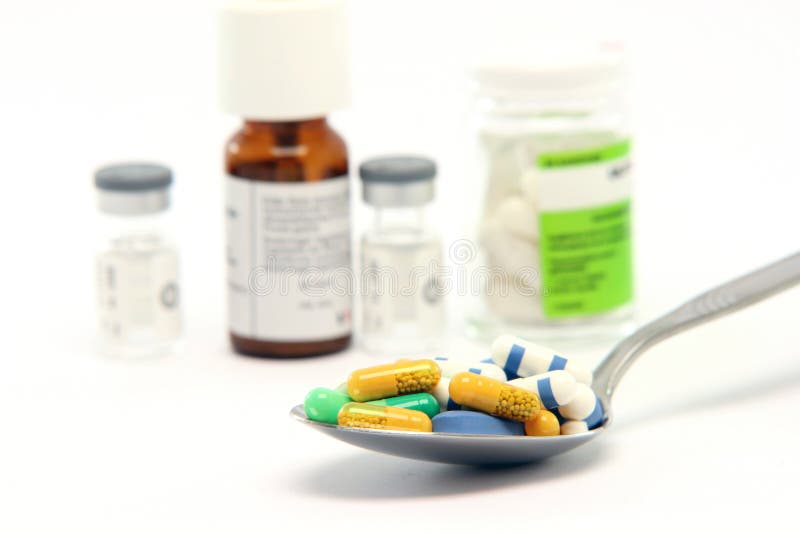 Spoon pills and bottles royalty free stock photography Spoon pills and bottles royalty free stock photography