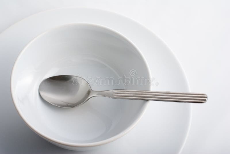 Spoon in porcelain bowl plate