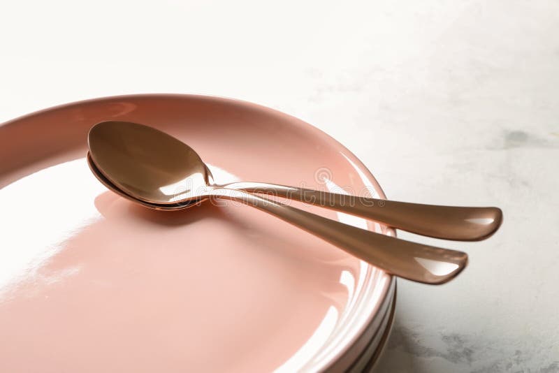 Spoons and Plates on Table, Closeup Stock Photo Image of setting