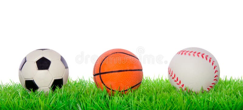 Sport balls on a green lawn