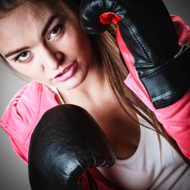 Sport boxer woman in black gloves boxing