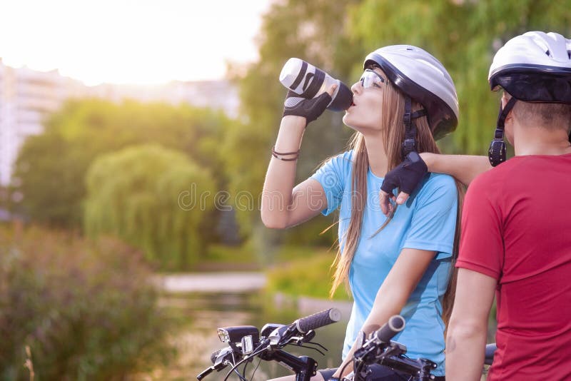 Sport and cycling Concept: Young Caucasian Cyclist Resting Toget