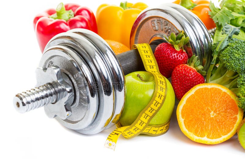 Chrome dumbbells surrounded with healthy fruits and vegetables on a white background. Chrome dumbbells surrounded with healthy fruits and vegetables on a white background.