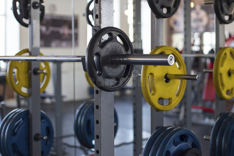 Close-up view of a barbells on a stand in the sports hall stock photos Close-up view of a barbells on a stand in the sports hall stock photos
