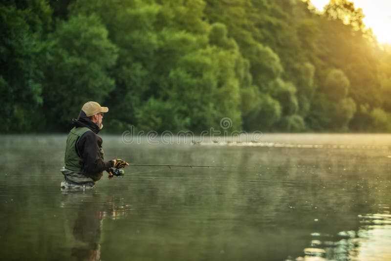 Sport fisherman hunting fish. Outdoor fishing in river
