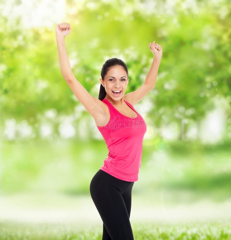 Sport fitness woman excited smile raised arm up