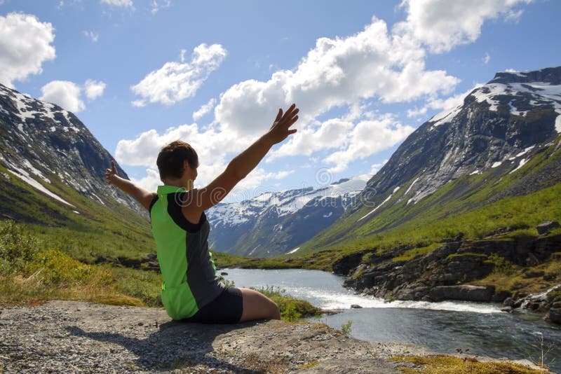 The sport girl near the mountain river