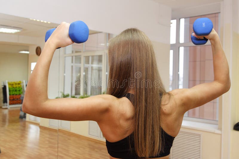 Sport girl with strong back