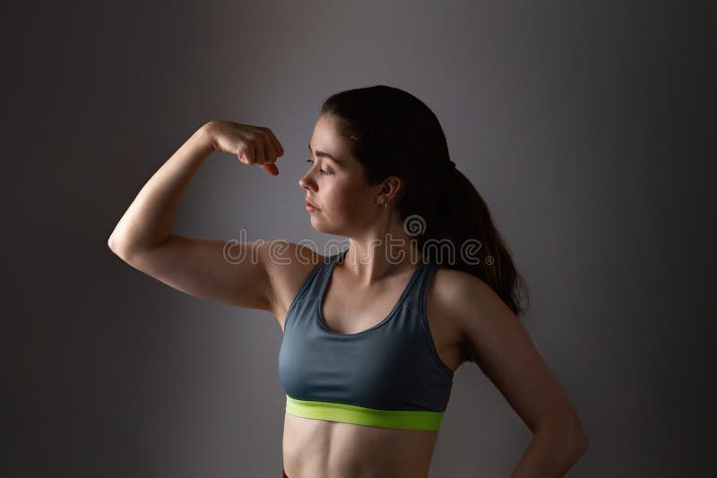 Portrait of Young Fitness Woman Shows Biceps Stock Image - Image of  athlete, athletic: 59823083