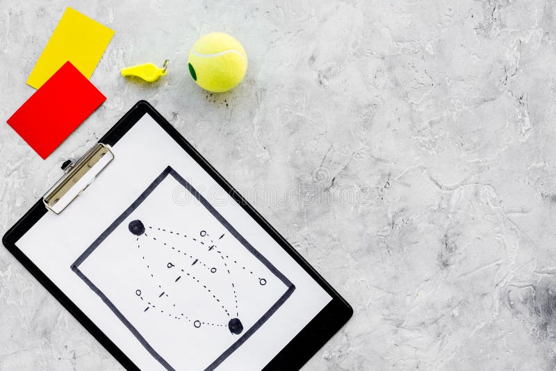 Sport judging concept. Soccer referee. Tactic plan for game, football ball, red and yellow cards, whistle on stone royalty free stock images Sport judging concept. Soccer referee. Tactic plan for game, football ball, red and yellow cards, whistle on stone royalty free stock images