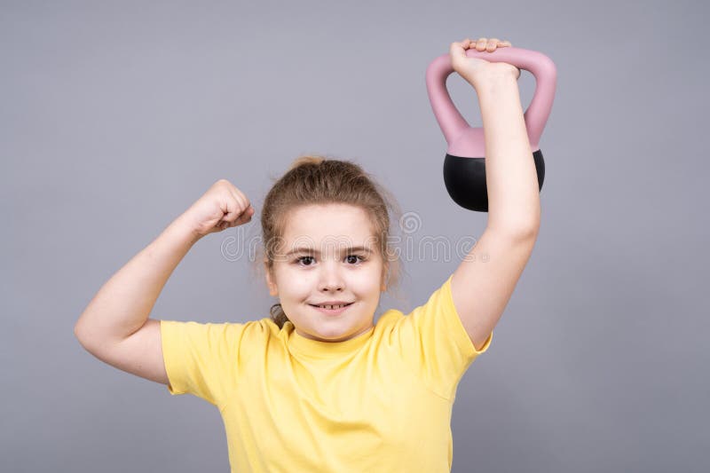 Sport for kids with kettlebell workout. Kettlebell lifting. Child kettlebell sport. Kid Kettlebell training. royalty free stock photography