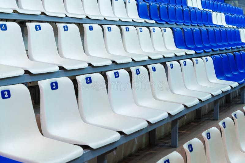 Tribune sports stadium with empty chairs Stock Photo - Alamy