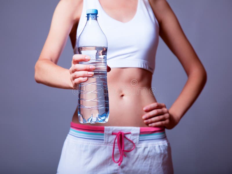 Sport woman with bottle.