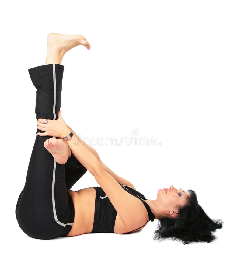Sport woman in makes exercise with leg up