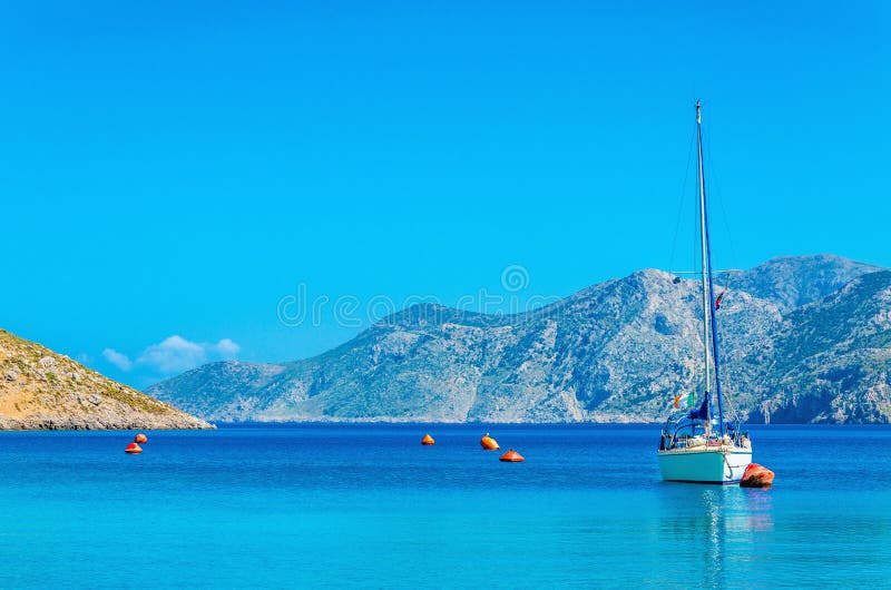 Sport yacht on anchor in bay of Greek Island royalty free stock photography Sport yacht on anchor in bay of Greek Island royalty free stock photography