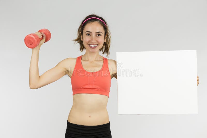 Sportieve vrouw die tekenraad tonen stock foto Sportieve vrouw die tekenraad tonen stock foto