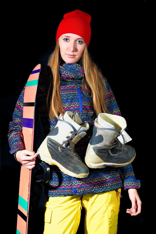 Sportig flicka med snowboardutrustning på svart bakgrund i dubb royaltyfria foton Sportig flicka med snowboardutrustning på svart bakgrund i dubb royaltyfria foton