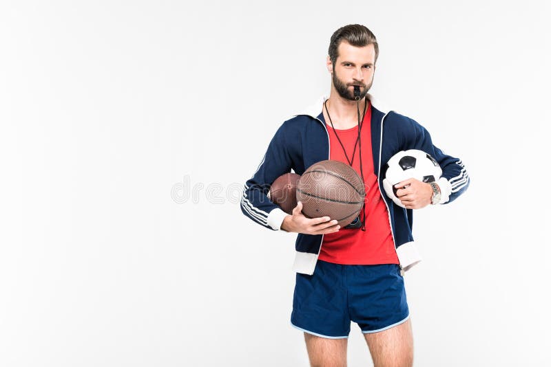 sportive coach with whistle holding rugby, basketball and soccer balls, stock photography sportive coach with whistle holding rugby, basketball and soccer balls, stock photography