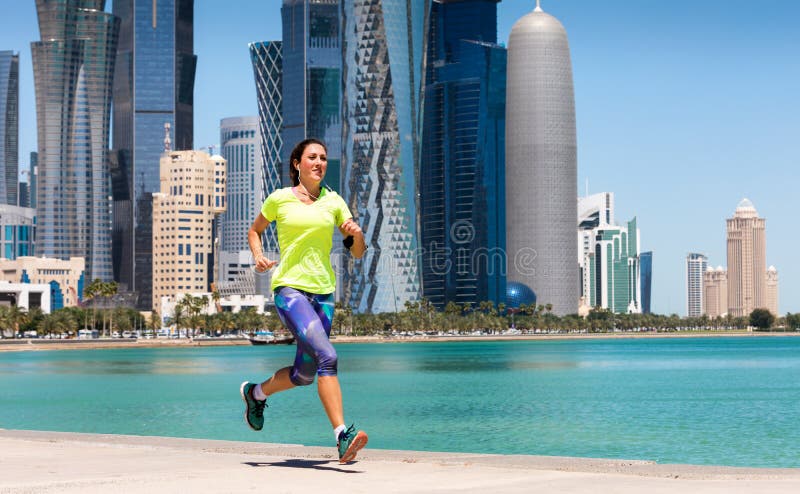 Sportive female runner in Doha, Qatar royalty free stock photography Sportive female runner in Doha, Qatar royalty free stock photography