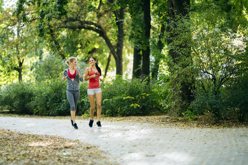 Sportive women jogging in park