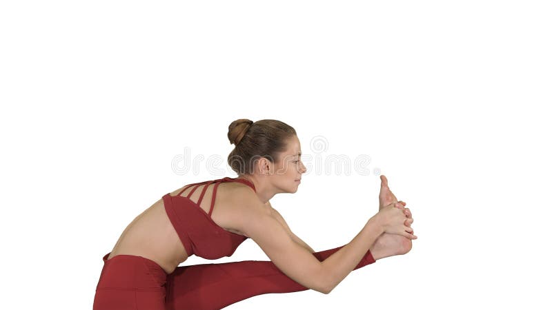 Sportliche schöne blonde junge Frau in der Sportkleidung, die Utthita Hasta Padangushthasana auf weißem Hintergrund tut stockfoto Sportliche schöne blonde junge Frau in der Sportkleidung, die Utthita Hasta Padangushthasana auf weißem Hintergrund tut stockfoto