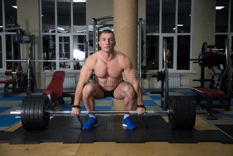 Sports Background. Young Athlete Getting Ready for Weight Lifting