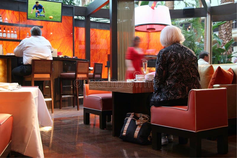Sports bar. People in a sport bar. Image on tv is my own Sports bar. People in a sport bar. Image on tv is my own