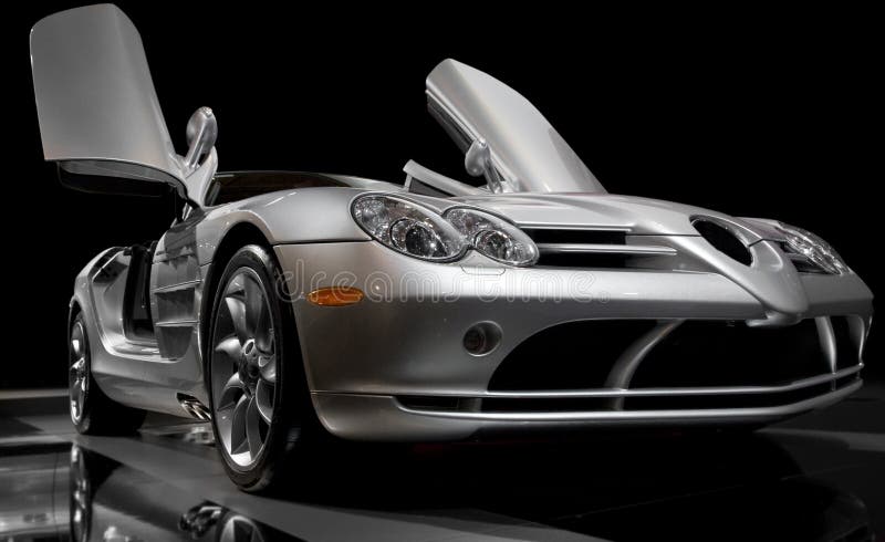 Sports car photo from low angle. With black backdrop.