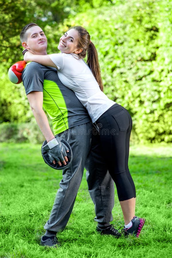 Sports couple in the park stock image. Image of gloves 45769111