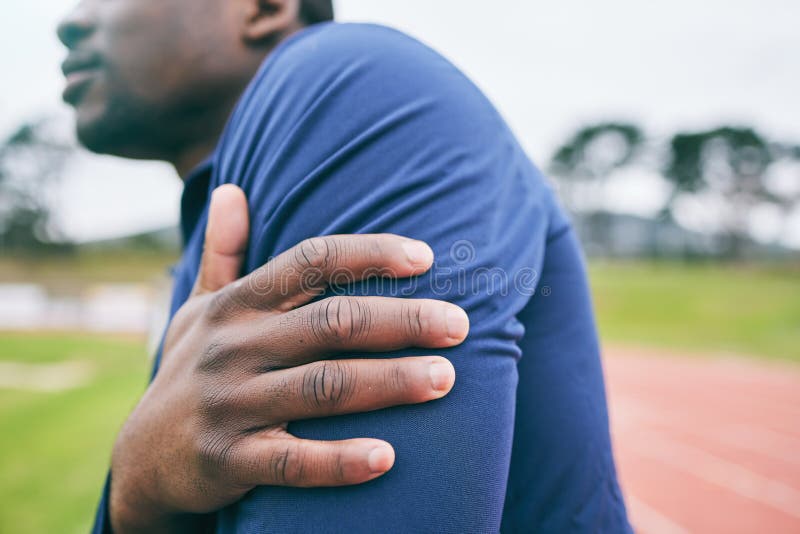 Sports, hands and black man with pain in arm from exercise, workout and marathon training in stadium. Fitness, runner