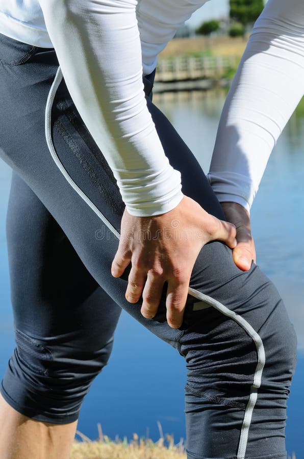 Sportsman feels muscle pain and grabs the leg. Spasm ache stock images, royalty-free photos and pictures