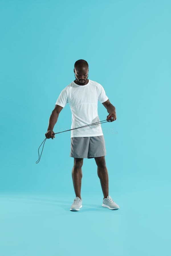 Sports Man in Sportswear with Skipping Rope at Studio Stock Photo - Image  of active, exercise: 157483022