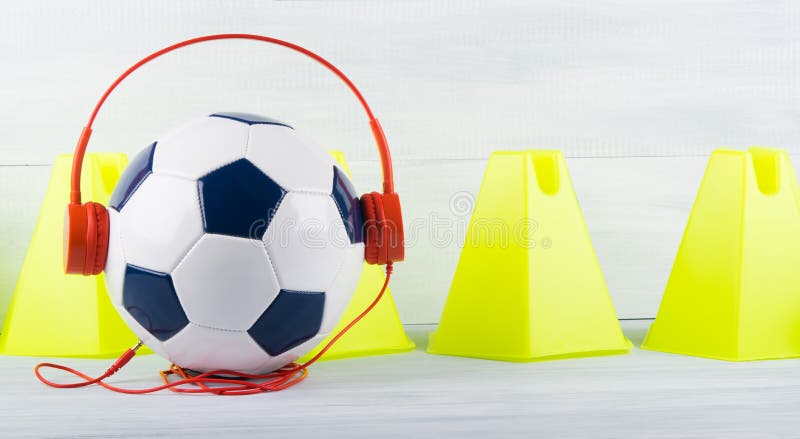Sports Music for Sports, Soccer Ball with Headphones, Against the Background  of Yellow Triangles Stock Photo - Image of football, listen: 118231232