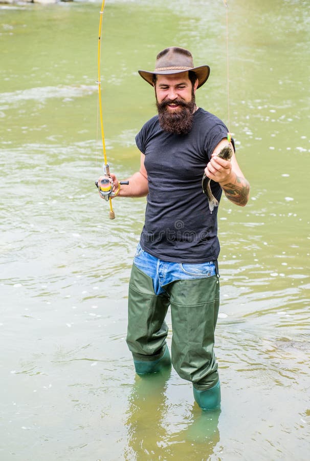 Sportsfishing. Fisherman Show Fishing Technique Use Rod. Happy Bearded Fisher In Water. Hobby And Sport Activity. Mature