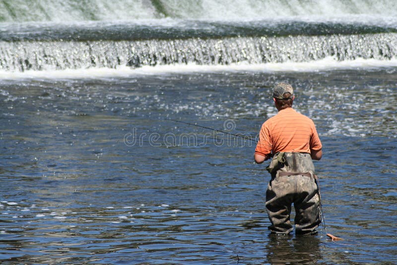 Pescador en presa.