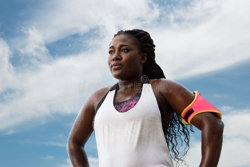 Sporty african woman  sweating after exercising on summer day. royalty free stock photography Sporty african woman  sweating after exercising on summer day. royalty free stock photography