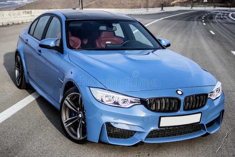 Sporty German bmw m3 sedan on a winding mountain road. Front corner view. Sporty German bmw m3 sedan on a winding mountain road. Front corner view.