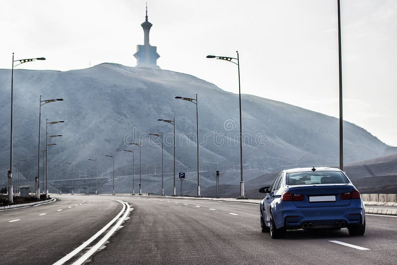 Sporty German bmw m3 sedan on a winding mountain road. fr