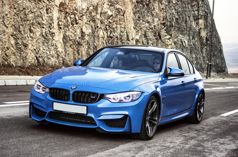 Sporty German bmw m3 sedan on a winding mountain road. fr