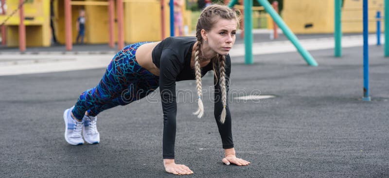 Sporty girl doing abs exercises.