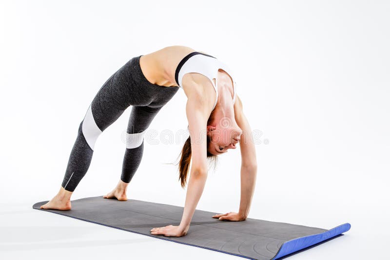 Sporty girl doing stretching exercise royalty free stock photography
