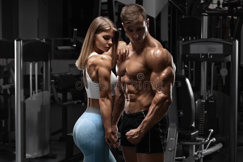 Sporty Couple Showing Muscle and Workout in Gym. Muscular Man and Woman Stock Image - Image of women, showing: 158669519 Sporty Couple Showing Muscle and Workout in Gym. Muscular Man and Woman Stock Image - Image of women, showing: 158669519